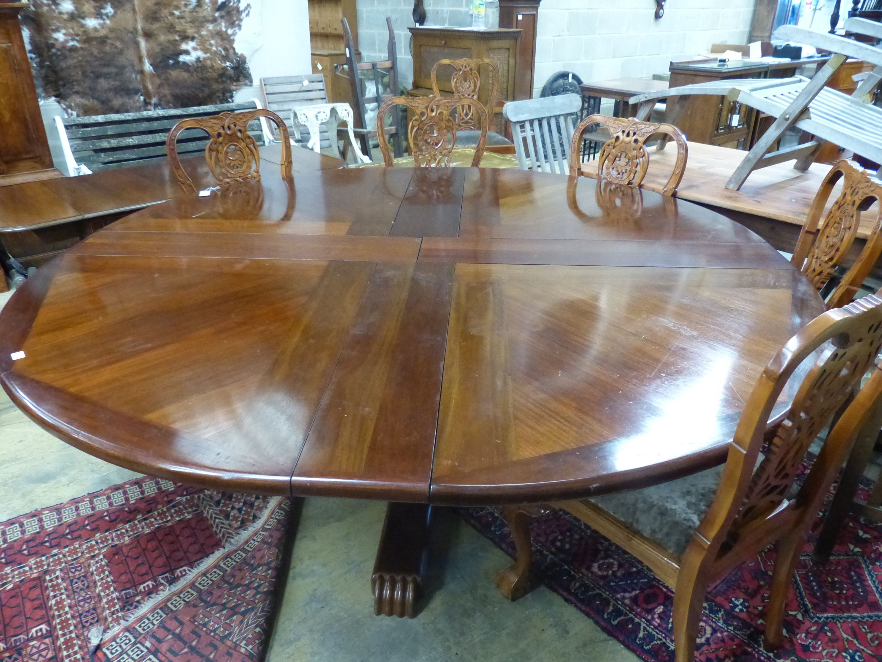 A Jupes patent style mahogany extending circular dining table, 224cm extended, height 74cm